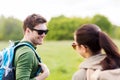 Smiling couple with backpacks in nature Royalty Free Stock Photo
