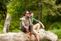 Smiling couple with backpacks in nature Royalty Free Stock Photo