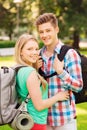 Smiling couple with backpacks in nature Royalty Free Stock Photo