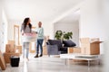 Smiling Couple Carrying Boxes Into New Home On Moving Day Royalty Free Stock Photo