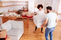 Smiling Couple Carrying Furniture Into New Home On Moving Day Royalty Free Stock Photo