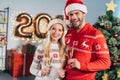 smiling couple with champagne glasses holding piggy bank with savings Royalty Free Stock Photo