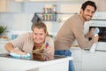 smiling couple cleaning kitchen Royalty Free Stock Photo