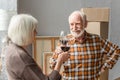 Smiling couple clinking glasses of wine
