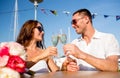 Smiling couple drinking champagne at cafe Royalty Free Stock Photo