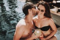 Smiling Couple Drinking Cocktails at Poolside Royalty Free Stock Photo