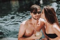 Smiling Couple Drinking Cocktails at Poolside Royalty Free Stock Photo