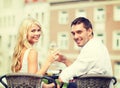 Smiling couple drinking wine in cafe Royalty Free Stock Photo