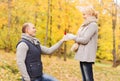 Smiling couple with engagement ring in gift box Royalty Free Stock Photo