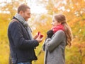 Smiling couple with engagement ring in gift box Royalty Free Stock Photo