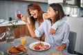 Couple is feeding each other in the kitchen and having fun. Love, Romance and valentineÃ¢â¬â¢s day concept