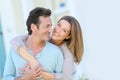 Smiling couple in front of the house Royalty Free Stock Photo