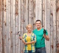 Smiling couple with hammer and drill