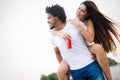 Smiling couple having fun over sky background. Holidays, vacation, love and friendship concept Royalty Free Stock Photo