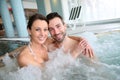 Smiling couple having a good time in jacuzzi Royalty Free Stock Photo