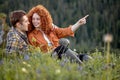 Friendly couple hiking in summer mountains in countryside. Happy woman and man Royalty Free Stock Photo