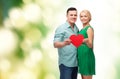 Smiling couple holding big red heart Royalty Free Stock Photo
