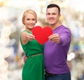 Smiling couple holding big red heart Royalty Free Stock Photo