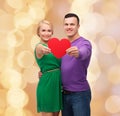 Smiling couple holding big red heart Royalty Free Stock Photo