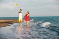 Smiling couple holding hands walking on beach Royalty Free Stock Photo