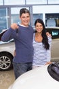 Smiling couple holding their new car key Royalty Free Stock Photo