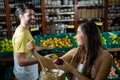 Smiling couple interacting with each other in organic section Royalty Free Stock Photo