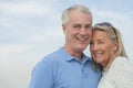 Smiling Couple Looking Away Against Sky Royalty Free Stock Photo