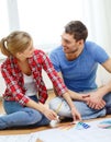 Smiling couple looking at color samples at home Royalty Free Stock Photo