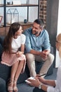 smiling couple looking at each other and sitting on therapy session by female counselor Royalty Free Stock Photo