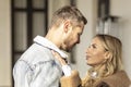 A smiling couple is in love outdoors.A young happy couple embraces on a city street