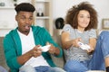 smiling couple lying on floor playing video games Royalty Free Stock Photo