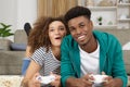 smiling couple lying on floor playing video games Royalty Free Stock Photo