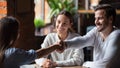 Smiling couple making successful deal, handshaking with realtor Royalty Free Stock Photo