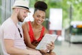 smiling couple man and woman with map