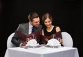 Smiling couple with menus at restaurant Royalty Free Stock Photo