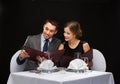 Smiling couple with menus at restaurant Royalty Free Stock Photo