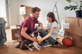 Couple in new home with their dog Royalty Free Stock Photo