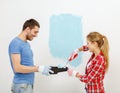 Smiling couple painting wall at home Royalty Free Stock Photo