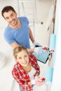 Smiling couple painting wall at home Royalty Free Stock Photo