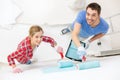 Smiling couple painting wall at home Royalty Free Stock Photo