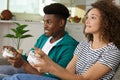 smiling couple playing video games