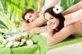 Smiling Couple Receiving Shoulder Massage At Spa Royalty Free Stock Photo