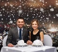 Smiling couple at restaurant Royalty Free Stock Photo