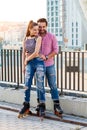 Smiling couple on rollerblades. Royalty Free Stock Photo