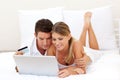 Smiling couple shopping online Royalty Free Stock Photo