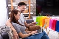 Smiling couple shopping online on laptop Royalty Free Stock Photo