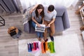 Smiling couple shopping online on laptop Royalty Free Stock Photo