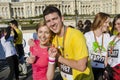 Smiling couple showing their medals