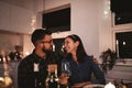 Smiling couple sitting at a table during a dinner party Royalty Free Stock Photo