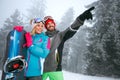 Couple snowboarder enjoying at ski resort in the mountain Royalty Free Stock Photo